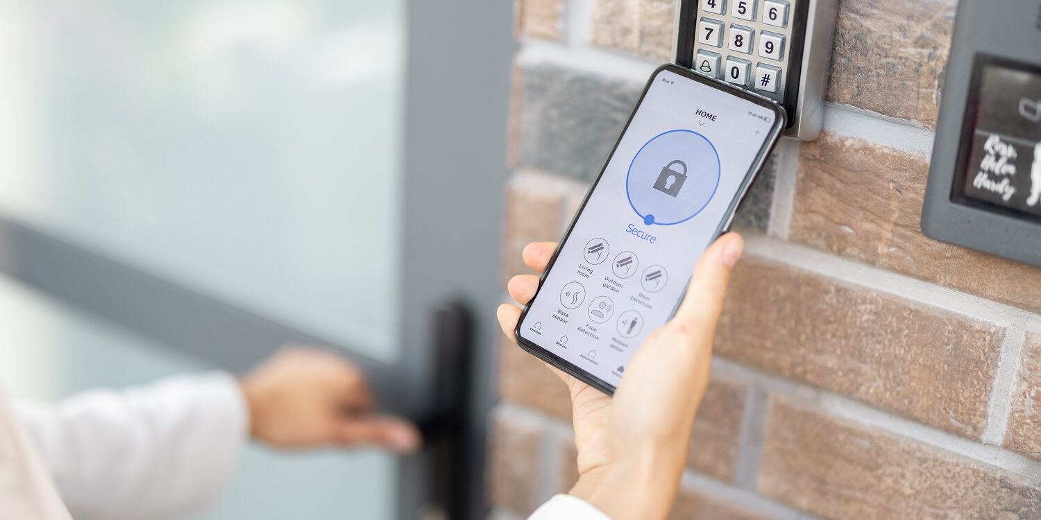Opening door with a smart phone and keyboard on the wall