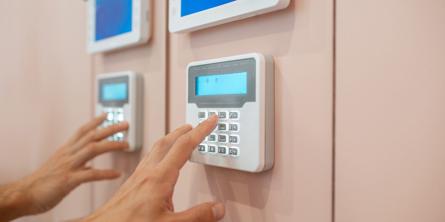 Man setting up the home alarm